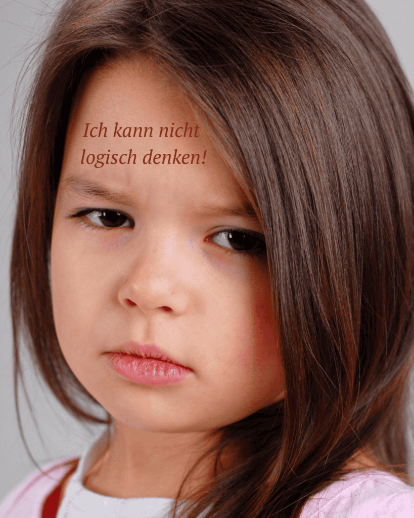Ein grimmig schauendes Mädchen mit dem Satz auf dem Kopf "Ich kann nicht logisch denken"